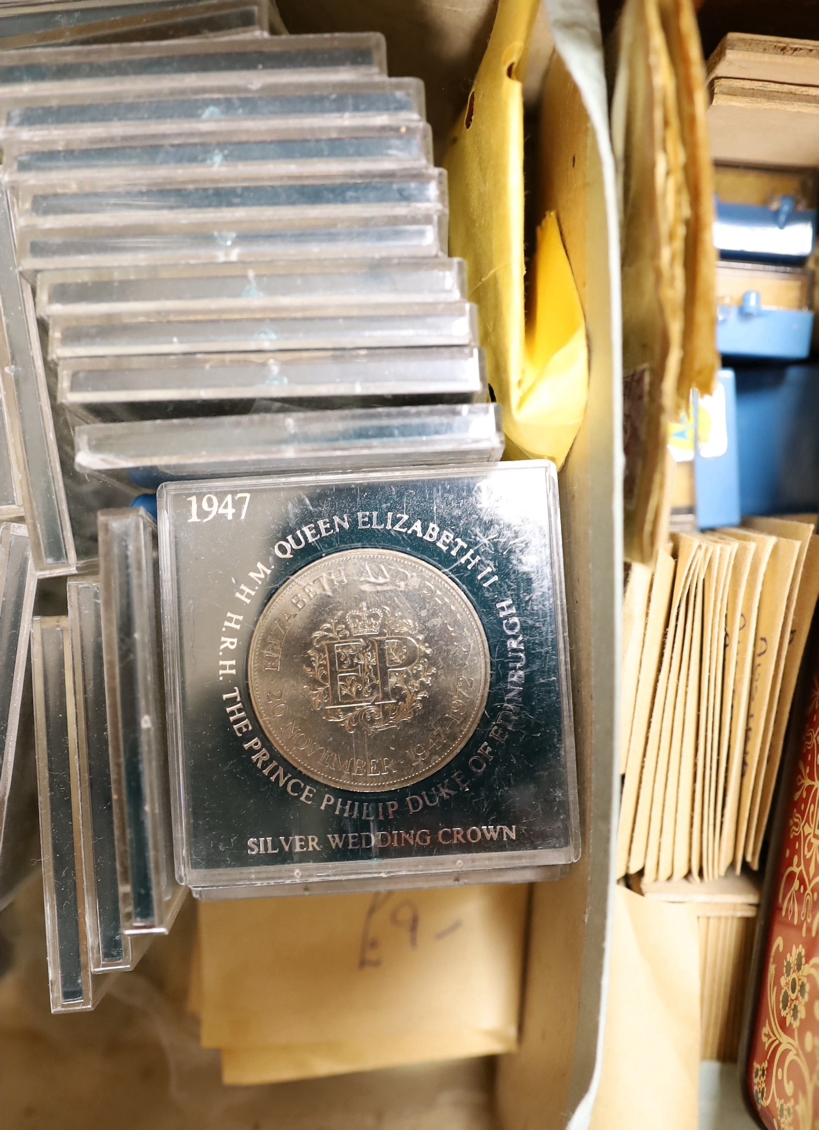 A collection of UK and Commonwealth coins and tokens 18th–20th century, the majority George VI onwards including commemorative crowns a 1974 coinage of Barbados set, a Victoria half Farthing etc . In a suitcase